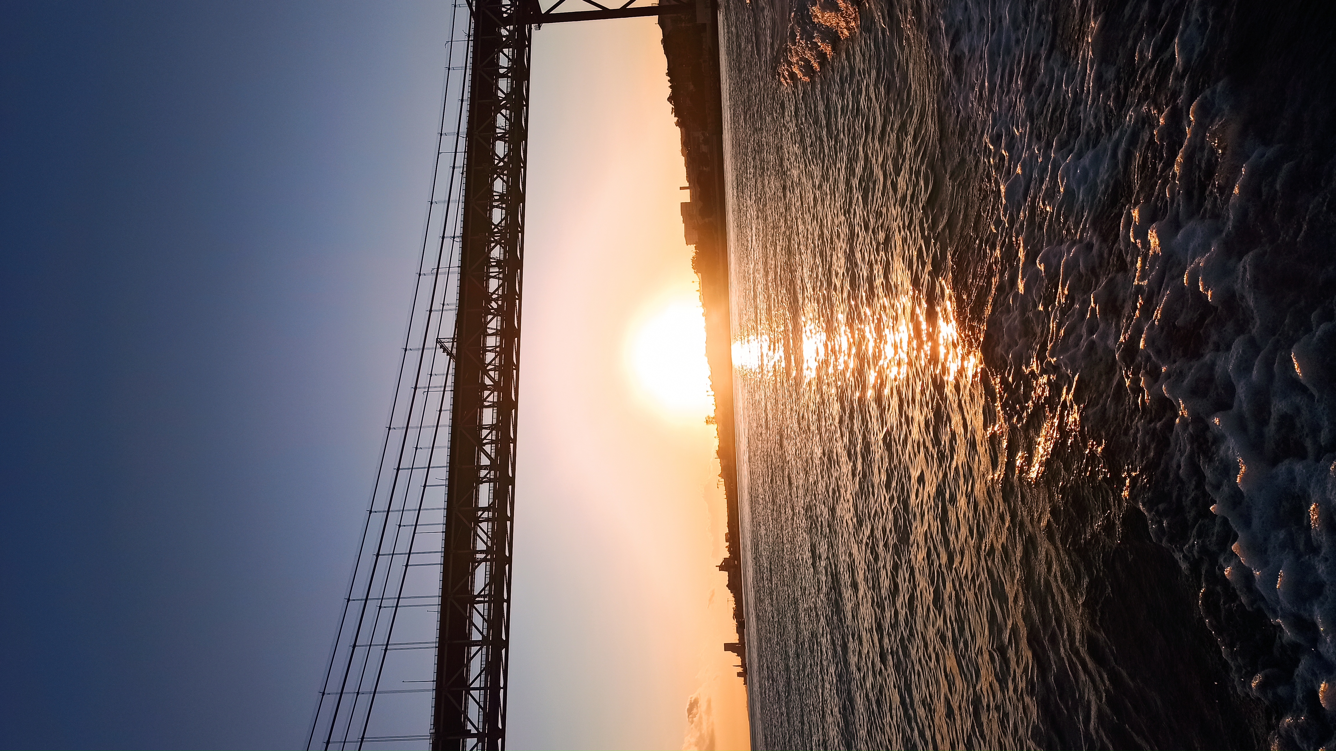 25 de Abril bridge at sunset from the boat